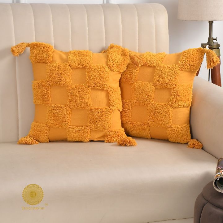Handcrafted set of two cushion covers by The Gharnish, featuring intricate designs and soft fabric for cozy home decor.