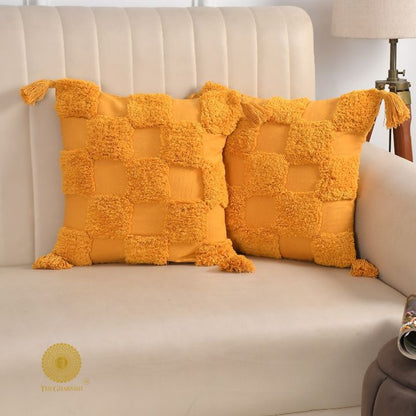 Handcrafted set of two cushion covers by The Gharnish, featuring intricate designs and soft fabric for cozy home decor.