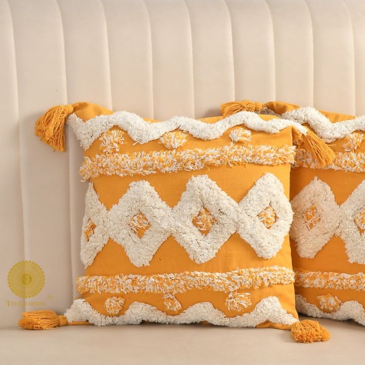 Set of two hand-embroidered cotton sofa cushion covers by The Gharnish, featuring intricate embroidery and soft fabric for stylish comfort.
