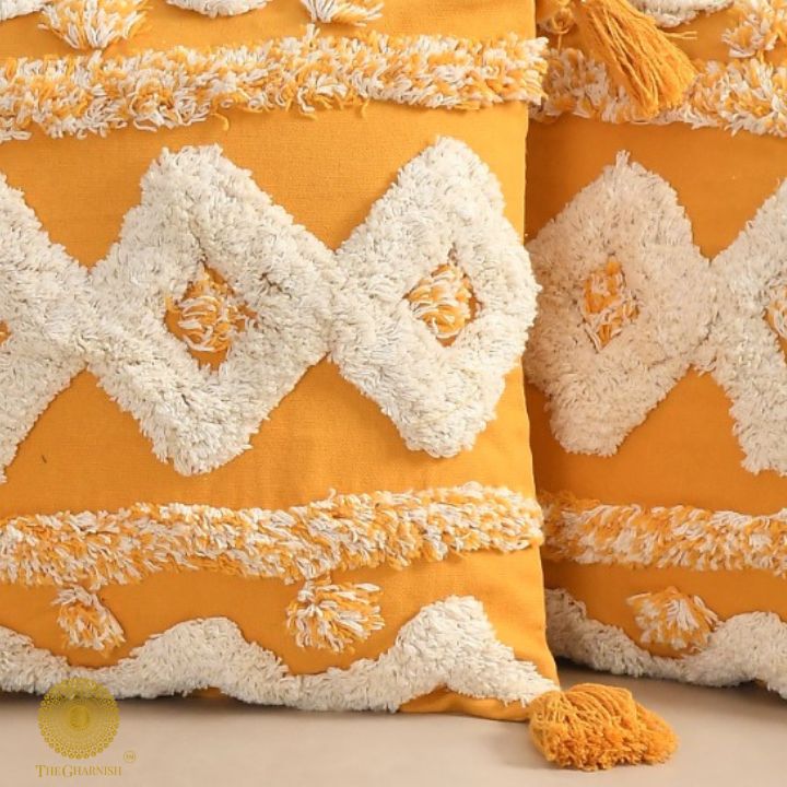 Set of two hand-embroidered cotton sofa cushion covers by The Gharnish, featuring intricate embroidery and soft fabric.