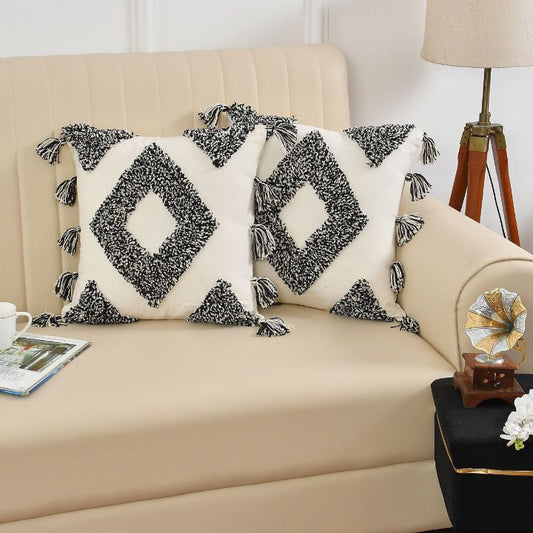 Set of two handcrafted boho cushion covers by The Gharnish, featuring colorful, woven textile designs for cozy, stylish decor.