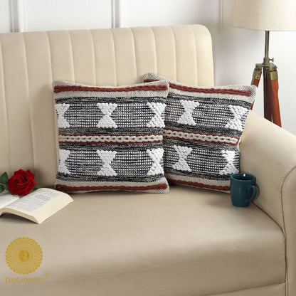 Set of two handcrafted thread work cushion covers by The Gharnish, featuring intricate embroidery and textile design.