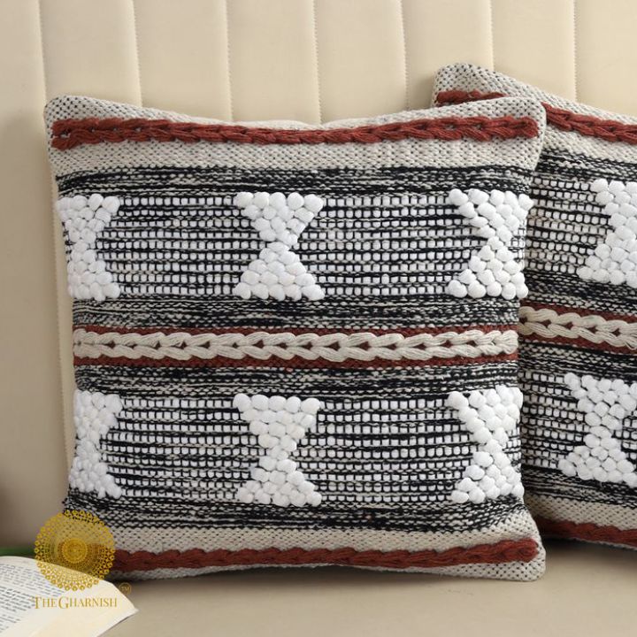 Set of two handcrafted cushion covers with intricate thread work, by The Gharnish, showcasing detailed textile craftsmanship.