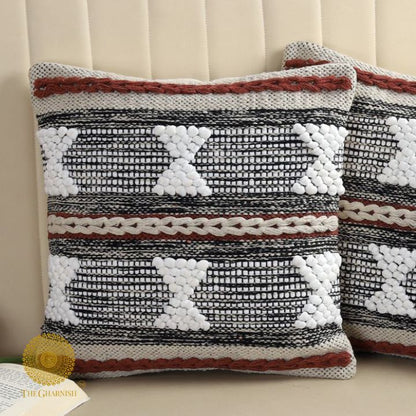 Set of two handcrafted cushion covers with intricate thread work, by The Gharnish, showcasing detailed textile craftsmanship.
