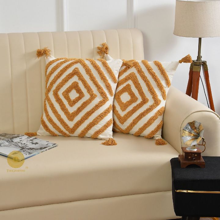 Set of two handcrafted cushion covers by The Gharnish, featuring vibrant, artistic designs on soft fabric for decorative cushions.