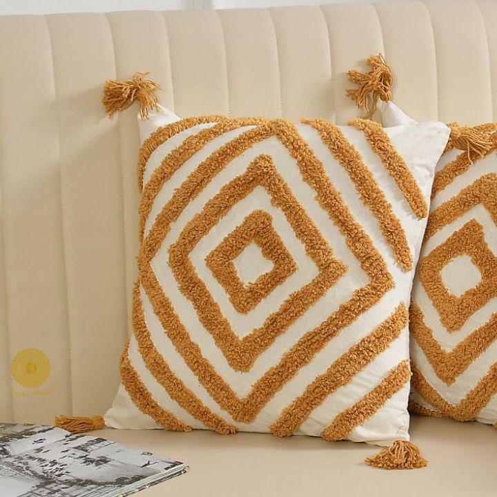 Set of two handmade handicraft cushion covers by The Gharnish, featuring intricate woven patterns and vibrant colors.