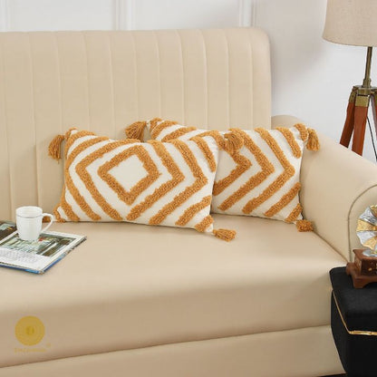 Set of two handcrafted cushion covers by The Gharnish featuring intricate textures and vibrant patterns.