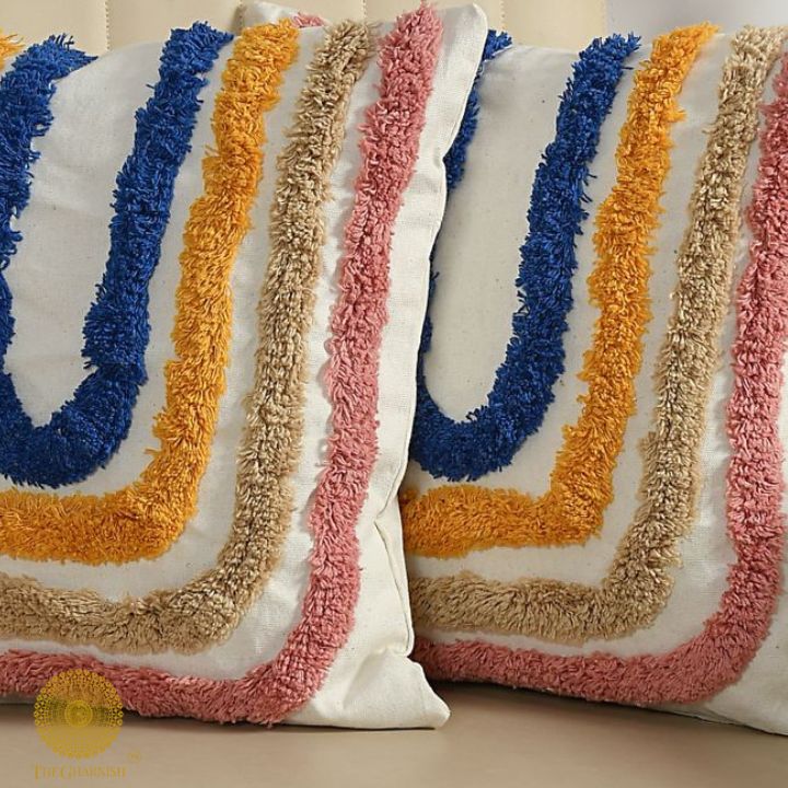 Set of two multicolor woven design cushion covers by The Gharnish, featuring vibrant patterns and textured fabric.