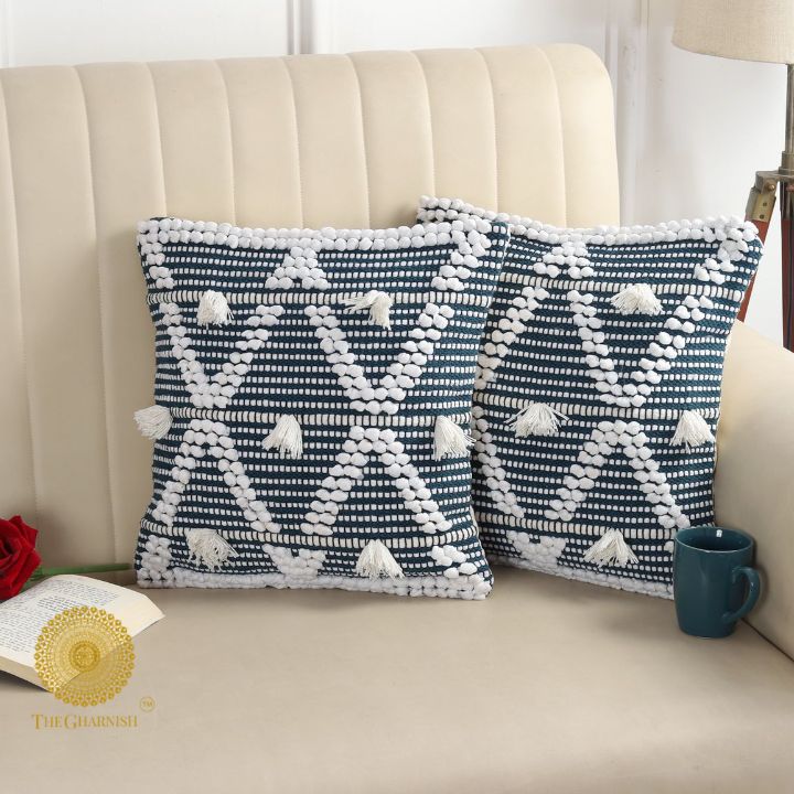 Set of two premium cotton and thread work cushion covers by The Gharnish, featuring intricate embroidery and soft fabric.