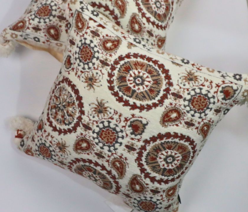 Pure cotton Hanblocked cushion cover with tassels by The Gharnish, featuring intricate hand-blocked patterns and tassel accents.