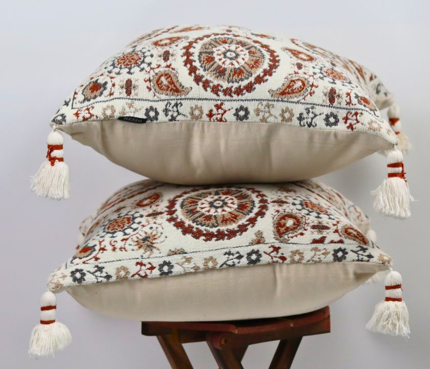 Pure cotton Hanblocked cushion cover with tussels from The Gharnish, featuring intricate patterns and decorative tassels.