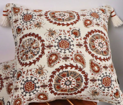 Pure cotton Hanblocked cushion cover with tassels by The Gharnish, featuring traditional pattern and decorative tassels.