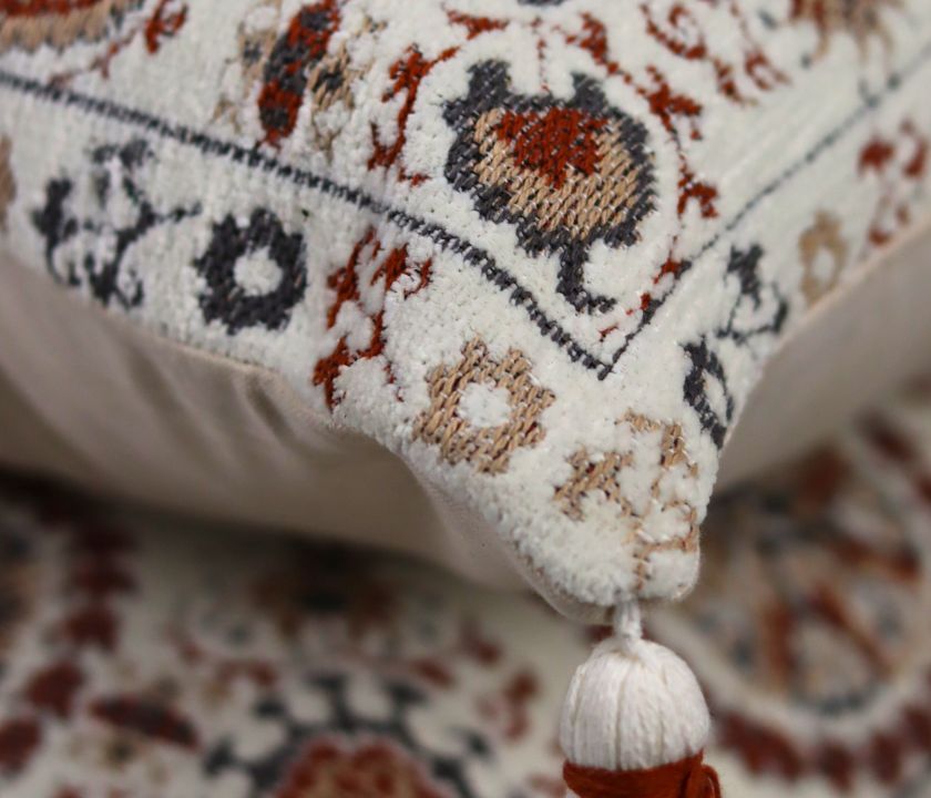 Pure cotton Hanblocked cushion cover with tussels by The Gharnish, featuring intricate design and decorative tassels.