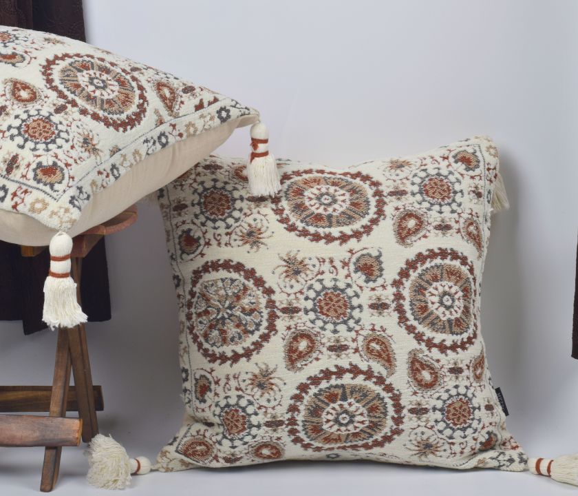 Pure cotton Hanblocked cushion cover with tassels from The Gharnish, featuring intricate hand-blocked patterns and decorative tassels.