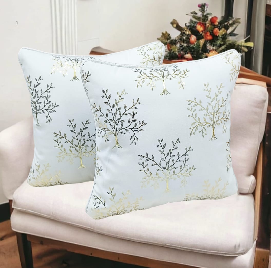 Set of two printed cushion covers by The Gharnish, featuring colorful, decorative cushion covers with intricate patterns.