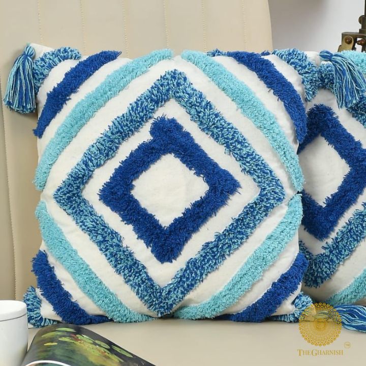 Handcrafted white and blue tassels cushion set of 2 by The Gharnish, featuring decorative tassels and soft fabric.