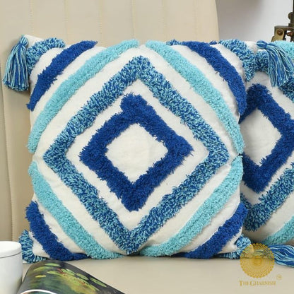 Handcrafted white and blue tassels cushion set of 2 by The Gharnish, featuring decorative tassels and soft fabric.
