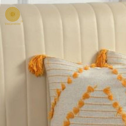 Set of two yellow tassel cushion covers by The Gharnish with handcrafted design and decorative tassels for stylish home decor.