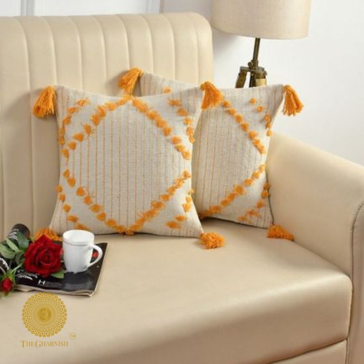 Set of two yellow tassel cushion covers by The Gharnish, handcrafted with stylish tassel details for home decor accents.