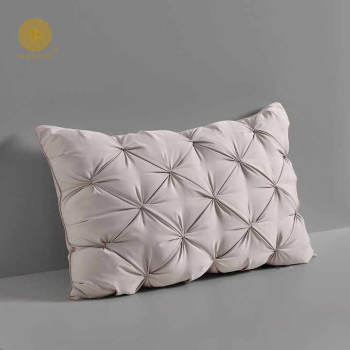 Pair of white feathery soft cushions from The Gharnish, showcasing plush, comfortable pillow cushions for cozy home decor.