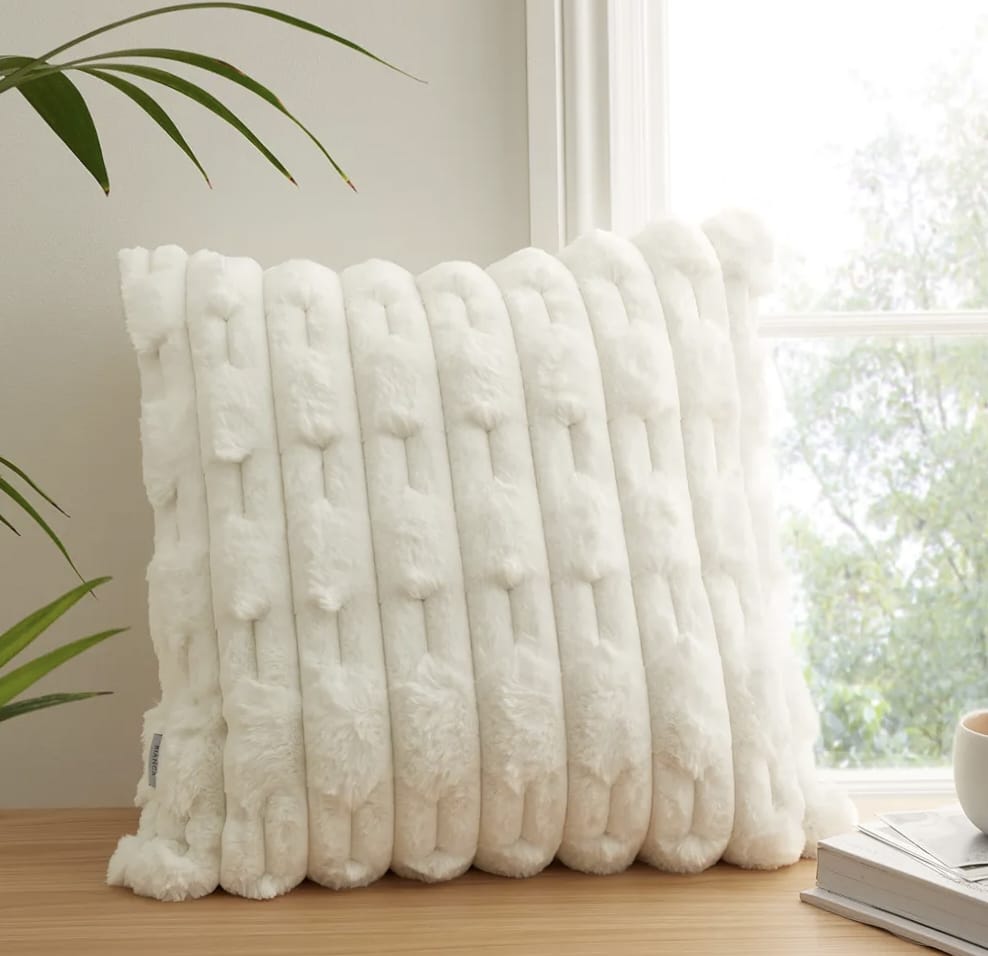 Set of two white rabbit fur cushion covers by The Gharnish, soft and plush decorative cushions for living room or bedroom.