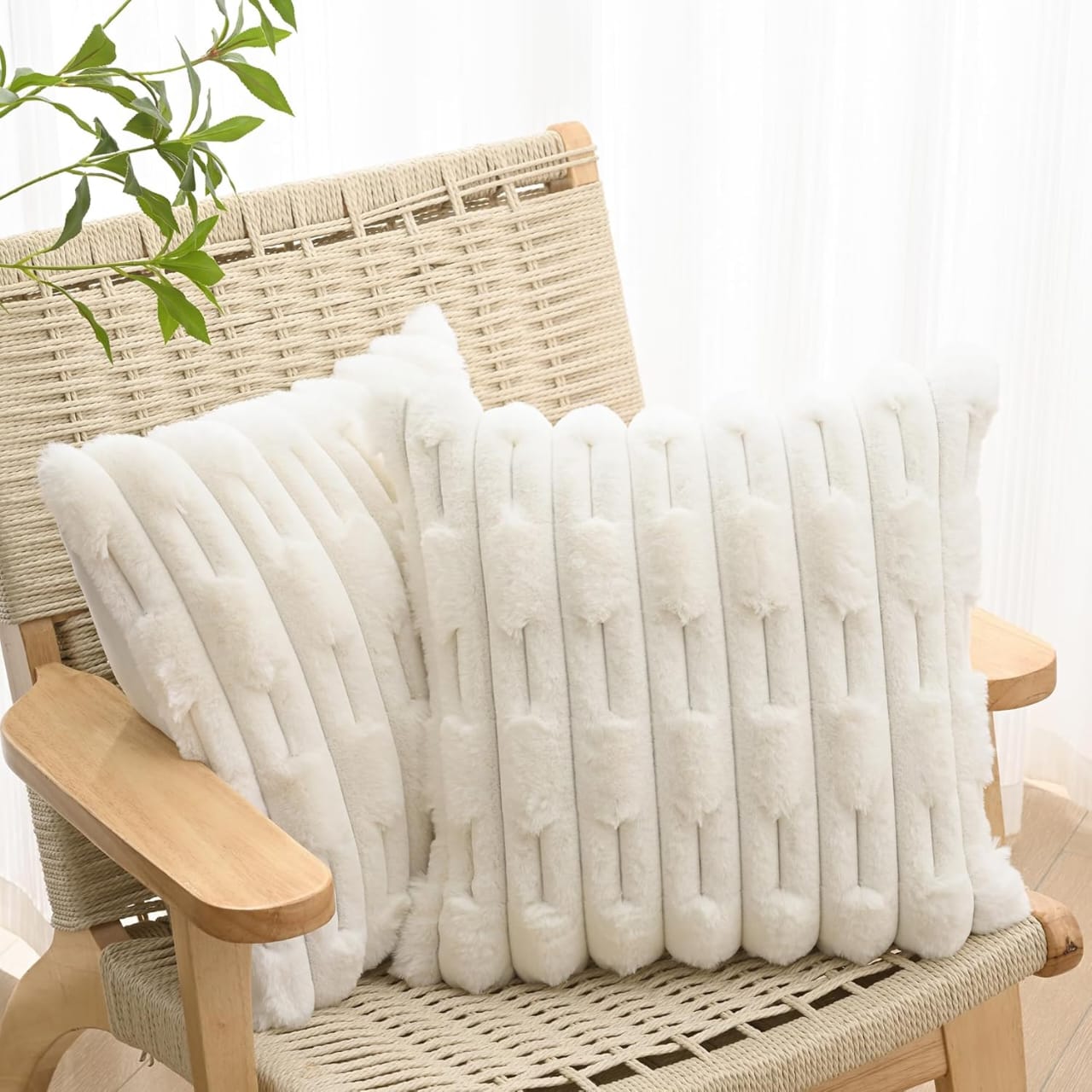 Set of two white rabbit fur cushion covers by The Gharnish, soft and plush decorative cushions for living rooms or bedrooms.