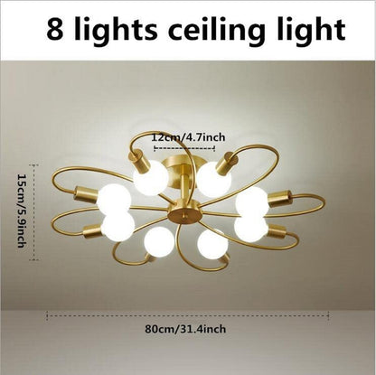 Gold metal ceiling pendant chandelier light from The Gharnish, designed as a stylish floor lamp with hanging pendant illumination.