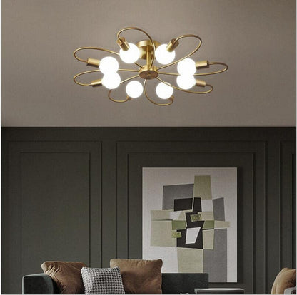 Metal gold ceiling pendant chandelier light by The Gharnish, showcasing a stylish and modern floor lamp design with elegant details.