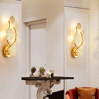 Gold finish luxury wall mount lamp by The Gharnish, featuring sleek metal design and elegant lighting for modern interiors.