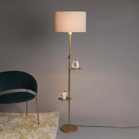 Modern gold metal floor lamp by The Gharnish, stylish and sleek for living room lighting with a contemporary design.