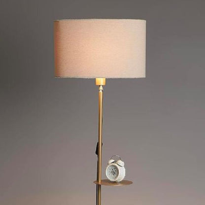 Modern gold metal floor lamp by The Gharnish, stylish floor lighting for living room decor with a sleek contemporary design.