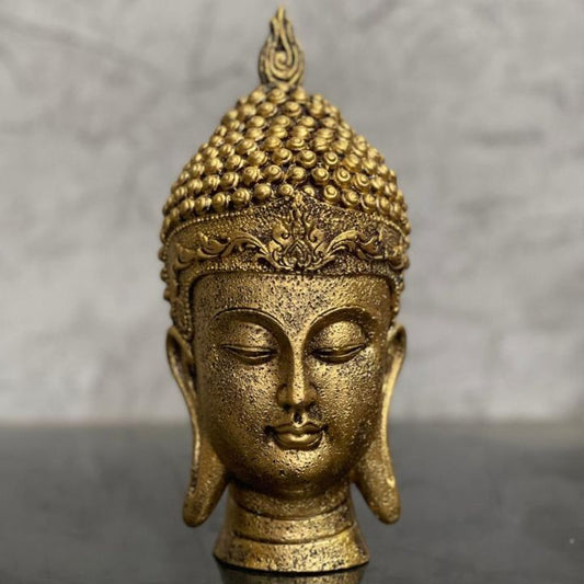 Gold-colored Buddha face figurine by The Gharnish, suitable for home and office Vastu, detailed and serene decorative gods showpiece.