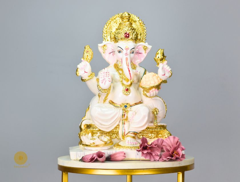 White marble-look Ganesha god figurine by The Gharnish, detailed Hindu deity statue with intricate carvings.