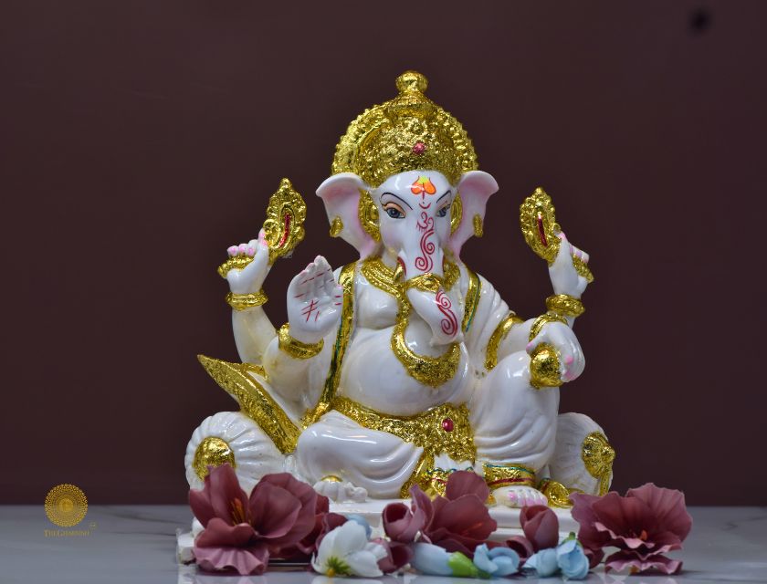 White marble Lord Ganesha statue, a detailed gods figurine with intricate carvings, ideal for spiritual decor or worship.