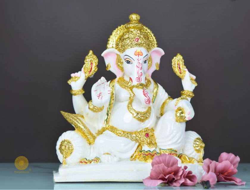 White marble Lord Ganesha statue, decorative gods figurine by The Gharnish, showcasing intricate craftsmanship and spiritual symbolism.
