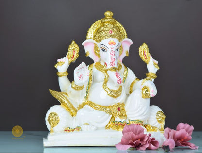 White marble Lord Ganesha statue, decorative gods figurine by The Gharnish, showcasing intricate craftsmanship and spiritual symbolism.