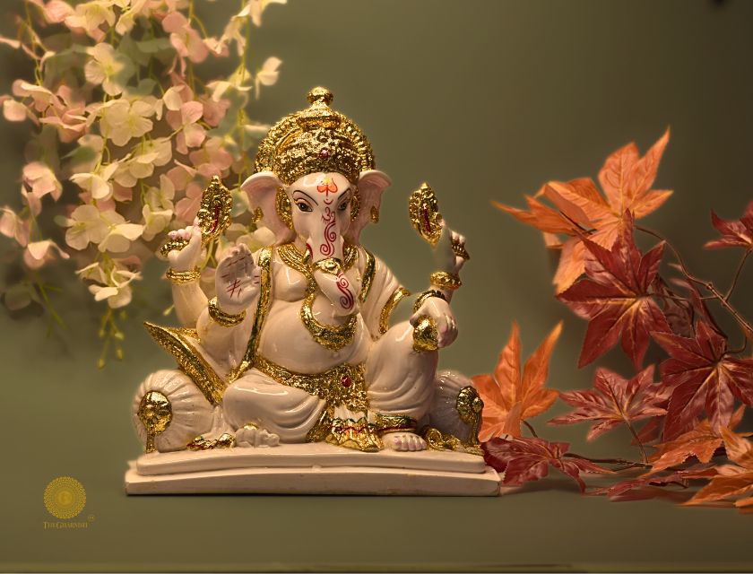 White marble Lord Ganesha figurine, intricately carved Hindu god statue by The Gharnish, detailed and decorative.