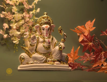 White marble Lord Ganesha figurine, intricately carved Hindu god statue by The Gharnish, detailed and decorative.