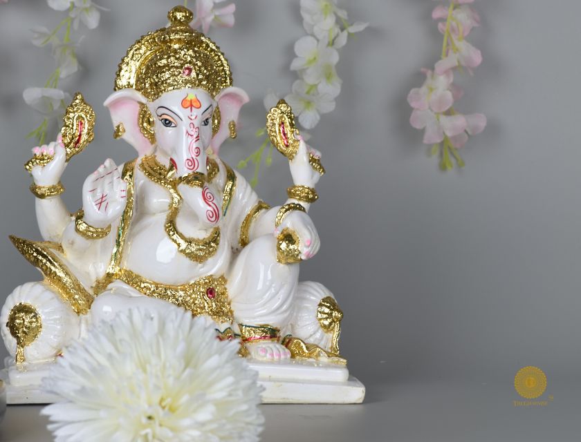 White marble Lord Ganesha statue, gods figurine by The Gharnish, showcasing intricate craftsmanship and sacred design.