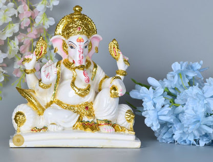White marble Lord Ganesha statue, a detailed gods figurine by The Gharnish, showcasing intricate craftsmanship and spiritual symbolism.