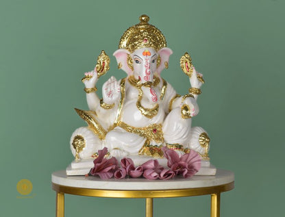White marble Lord Ganesha statue, a detailed gods figurine by The Gharnish, showcasing intricate craftsmanship and spiritual symbolism.
