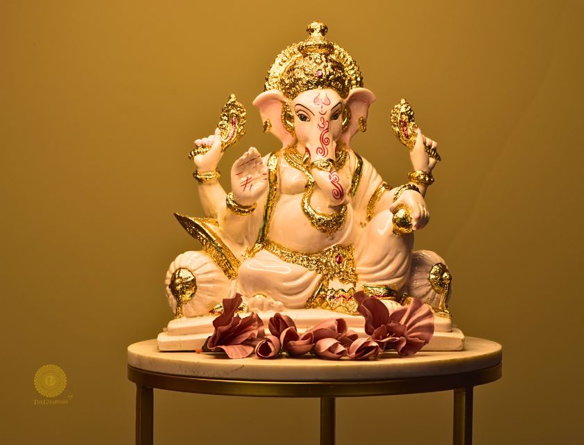 White marble Lord Ganesha figurine, a gods statue by The Gharnish, showcasing intricate craftsmanship and spiritual symbolism.