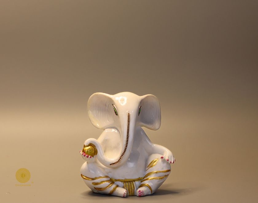 Left side view of The Gharnish Vaastu Ganesha God Figurine, traditional Hindu deity statue for spiritual decor.