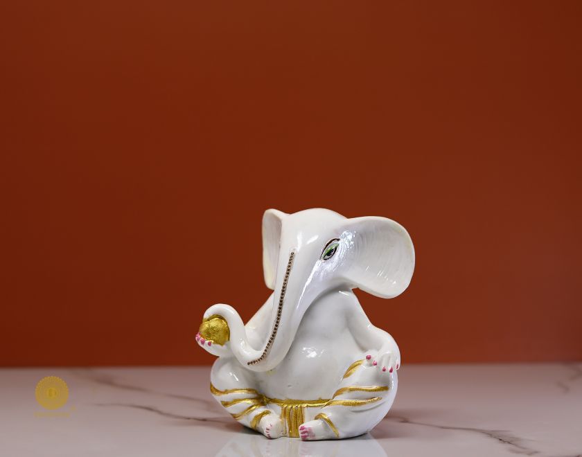 Left side view of The Gharnish Vaastu Ganesha statue, a detailed gods figurine with intricate carvings and traditional design.
