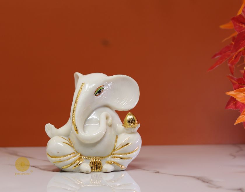 Left-side view of The Gharnish Vaastu Ganesha God figurine, intricately carved statue for positive energy and spiritual harmony.