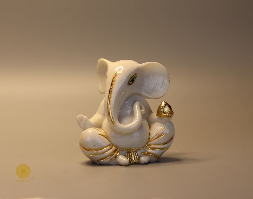 Left side view of The Gharnish Vaastu Ganesha statue, a detailed gods figurine with traditional design and intricate carvings.