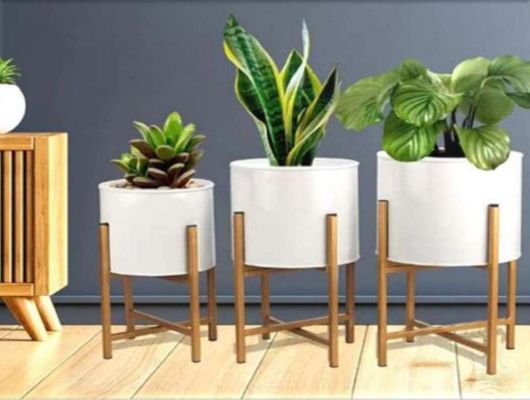 Set of three metal planters with stand by The Gharnish, ideal for home or office decor, featuring modern design and sturdy construction.