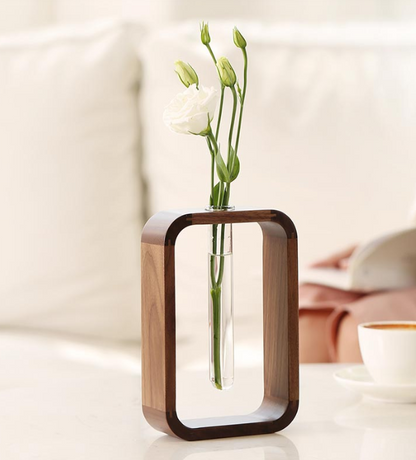 Wooden holder with a sleek planter tube from The Gharnish, ideal for indoor plants or decorative greenery.