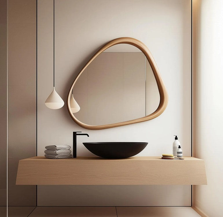 Modern living room mirror with an asymmetric wood frame by The Gharnish, designed for stylish home decor.