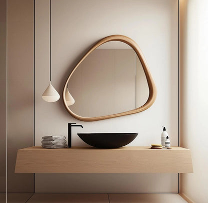 Modern living room mirror with an asymmetric wood frame by The Gharnish, designed for stylish home decor.